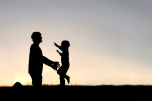 Happy Young Child Running To Greet Dad Silhouette