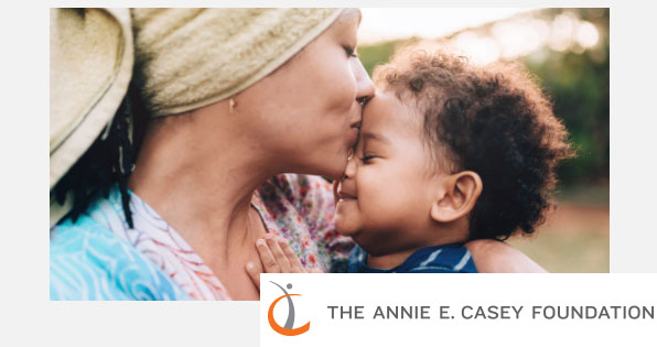 Annie E. Casey Foundation logo and image of mother kissing child.