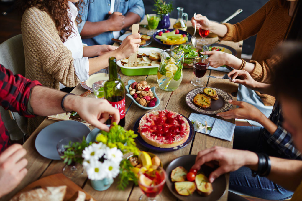 Group of people at a table with food.