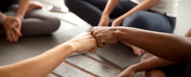 Two people fist bumping.