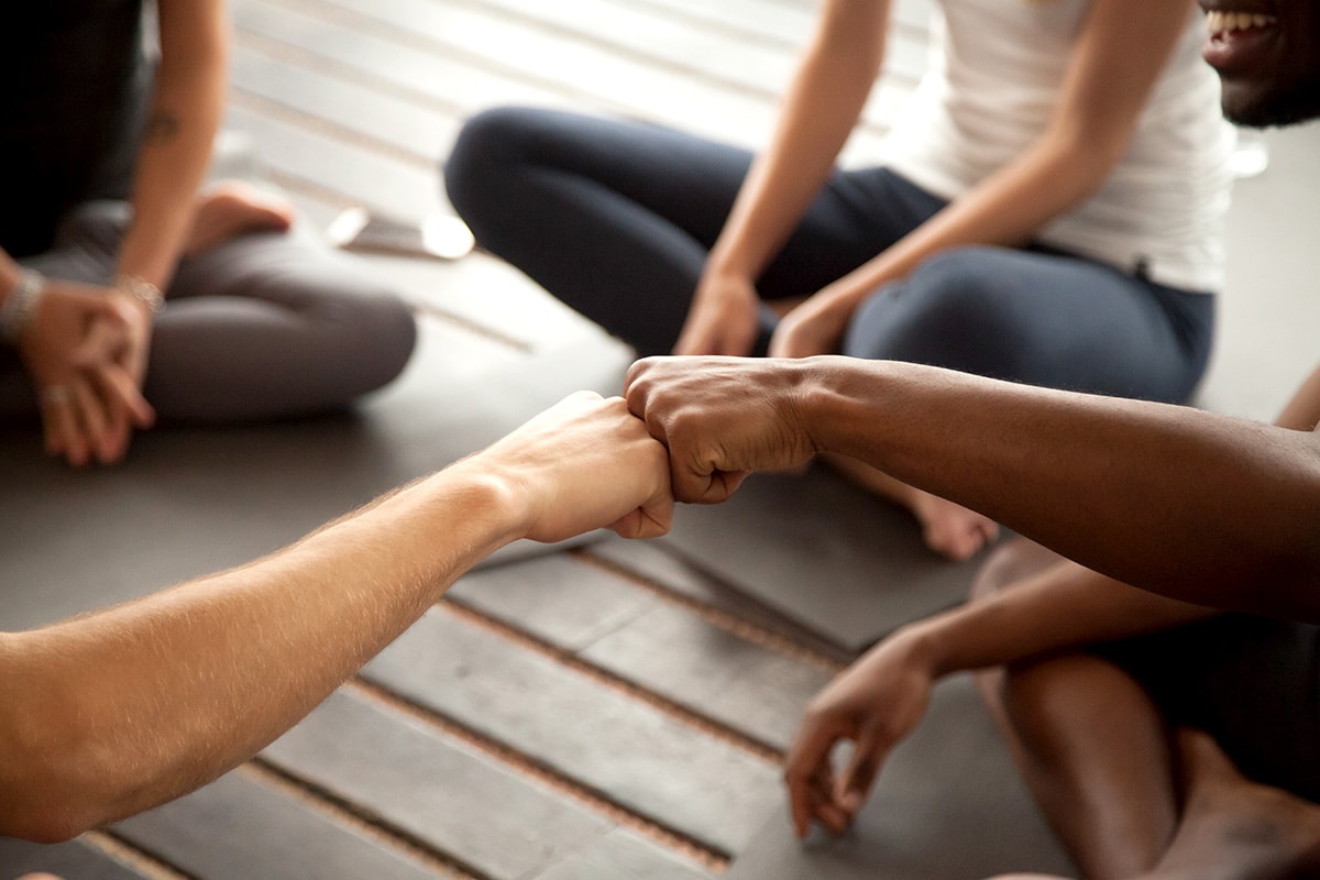 Two people fist bumping.