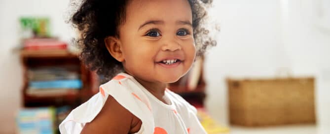Toddler girl smiling.