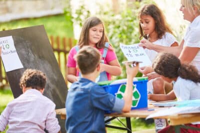 Children's group as volunteer environmentalists in a recycling project.