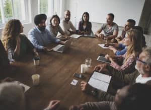 Diverse,people,teamwork,on,meeting,table