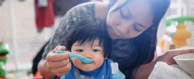 Mother Feeding Child