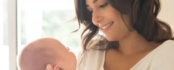 Mother holding newborn baby.