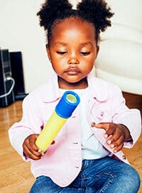 Toddler holding a toy