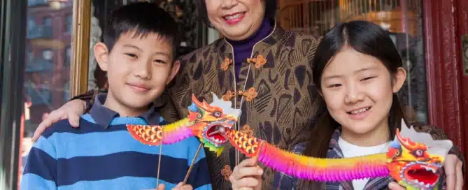 Asian family in front of store