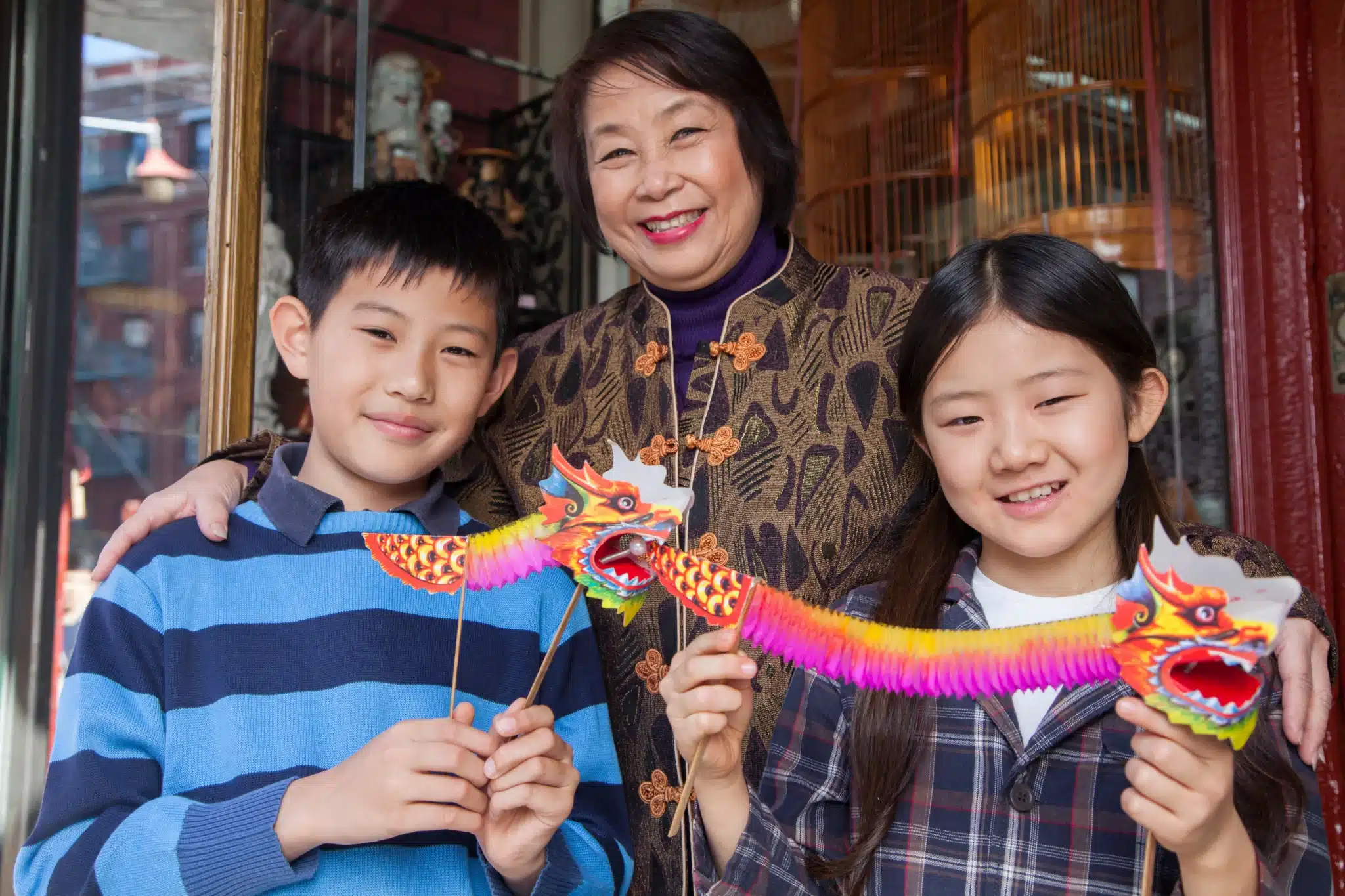 Asian family in front of store