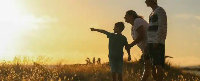 A family looks out into the sunset