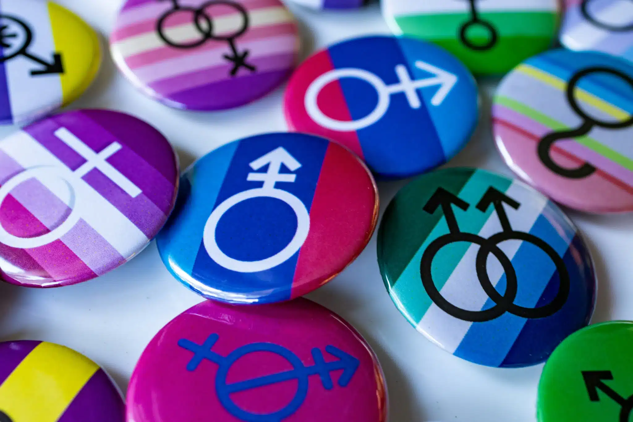 a pile of pins representing different genders