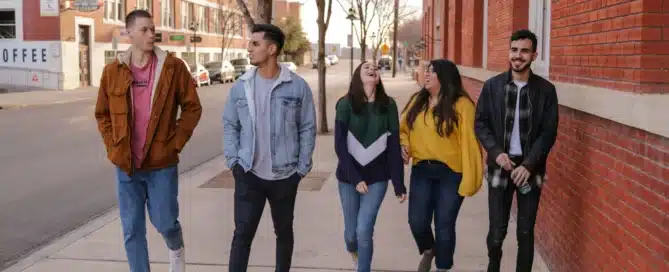 a group of teens walking down the street