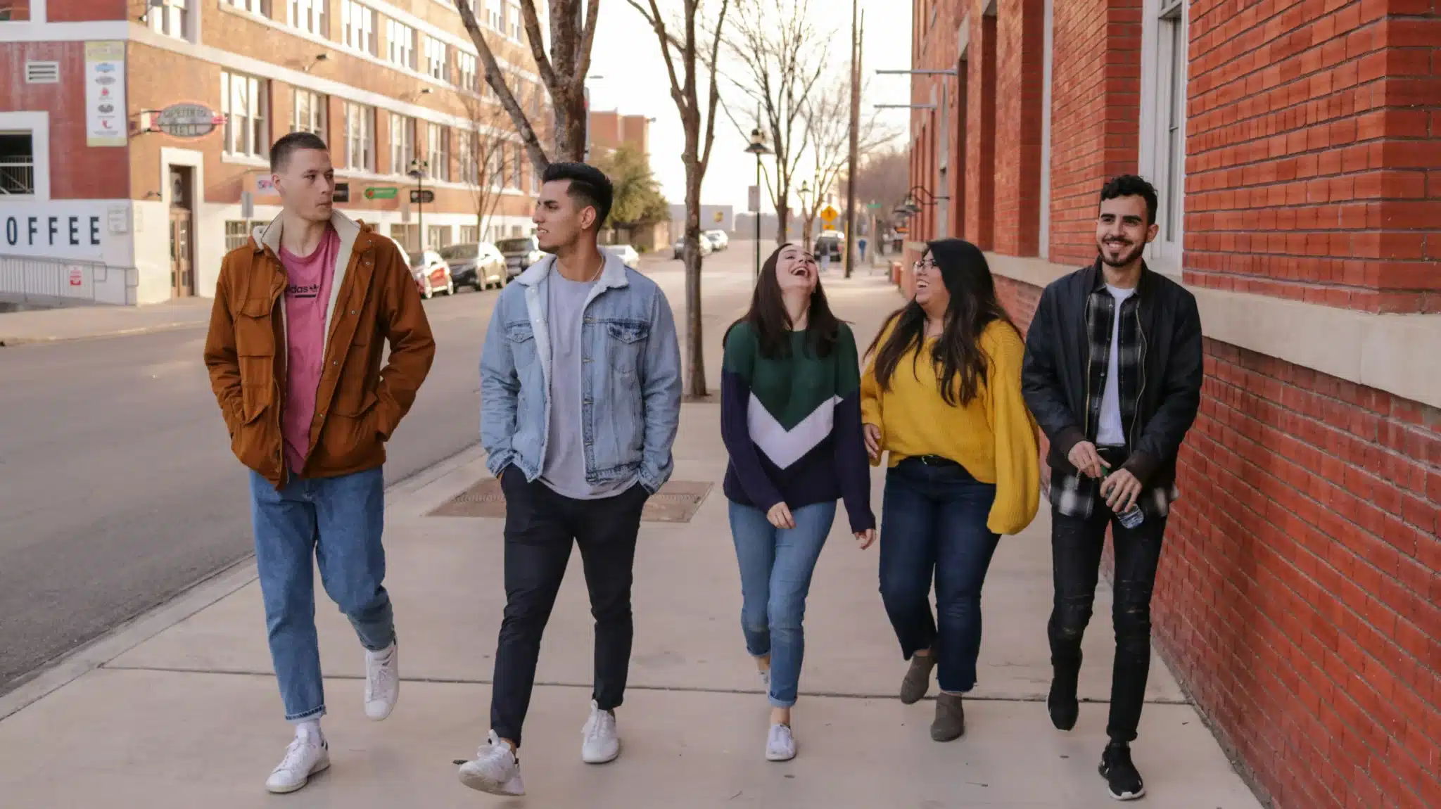 a group of teens walking down the street